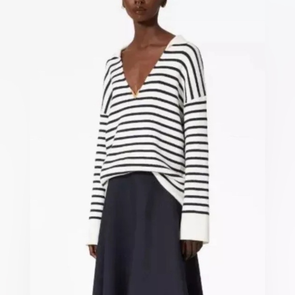 Sweater is new without tags. Fit is oversized.